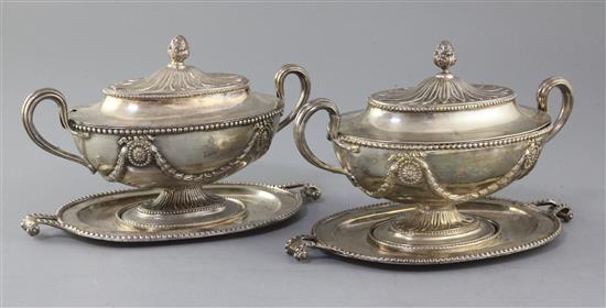 A pair of George III silver oval two handled sauce tureens, covers and stands by Tudor & Leader, 44.5 oz.